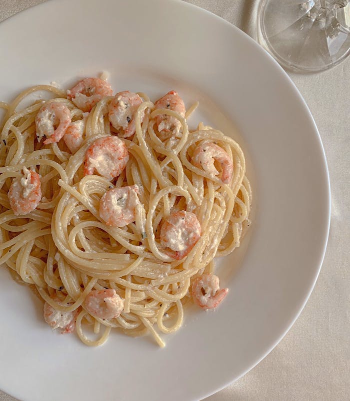 Creamy shrimp spaghetti pasta plated elegantly for a delicious meal.